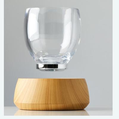 China hotsale magnetic levitation transparent glass cup drink display stand for sale