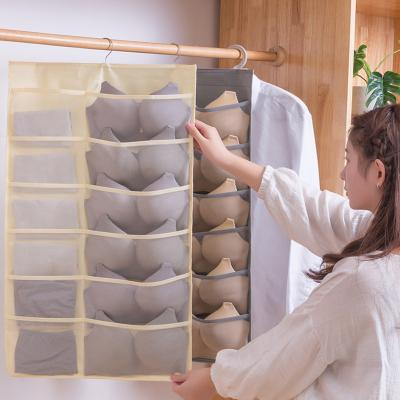 China Double Sided Wall Mounted Gifts Wardrobe Artifact Household Jars Non Woven Hanging Storage Bag Bra Storage Bag Underwear Storage Bag for sale