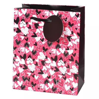 China Creative Materials 2021 New Fashion Recycled Gift Paper Bag Wedding Gift Packaging Bag Birthday Package With Handbag for sale