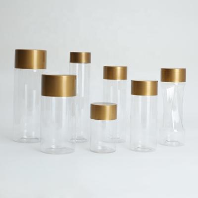 China Wholesale Golden Tall Plastic Food Storage Jars With Lids 260ml 470ml 16 Ounce for sale