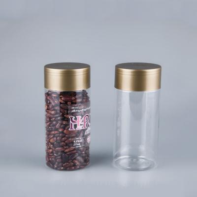 China 440ml 500ml Plastic Food Grade Containers Candy Storage Jars With Gold Lids for sale