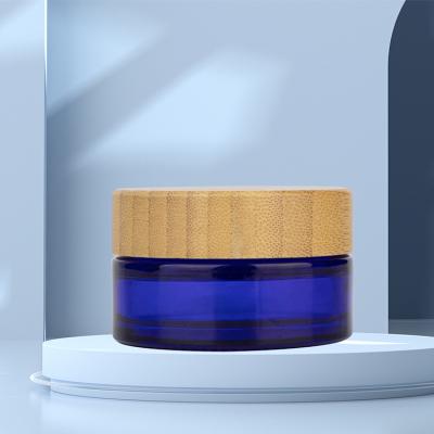 China 15ml 30ml 50ml 100ml Cosmetic Packaging Face Cream Jars 15ml 30ml 50ml 100ml Cobalt Blue Bamboo Cosmetic Glass Jars With Bamboo Wooden Lids for sale