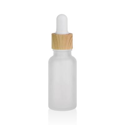 China 20ml Cosmetic Glass Bottle With Bamboo Dropper 10ml 15ml 25ml 30ml 50ml Essential Oil Face Serum Frosted Wooden Glass Dropper Bottle for sale