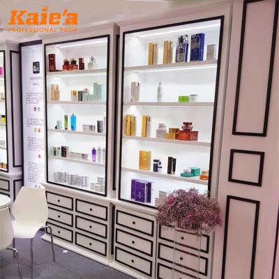 China Modern Makeup Studio Wooden Cosmetic Display Rack Makeup Display Unit for sale