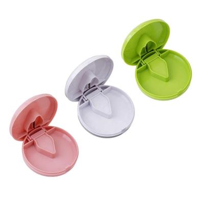 China Eco-friendly Promotional Medicine Splitter Pill Organizer Weekly Dose Pill Cutter Around Plastic Divider Cup Pill Storage Box with Safety Shield for sale