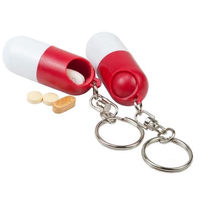 China Eco-friendly Weekly Key Pill Organizer PW23029 Chain Capsule Shaped Pill Box Organizer Packing Storage Drug Holder Container for sale