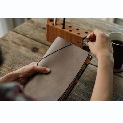 China Gift Business High Quality A5 Notebook 6 Ring PU Leather Loose Leaf Soft Cover With Strap Elastic Diary Spiral Notebook for sale