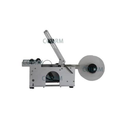 China COURM Small Semi Labeling Machine Desktop Mini Manual Bottle Labler Price Tagger Sticker Labeling Machine For Small Round Bottle for sale