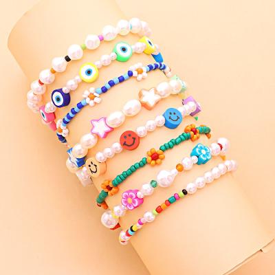 China 2022 New FASHIONABLE Bead Bracelets Anklet Chain Trend Pottery Colorful Soft Eyes Flower Smiley Rice Bead Footwear Set For Women Fashion Jewelry for sale