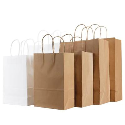 China Recyclable White Kraft Paper Bag With Handles Wedding Party Sack Fashionable Clothes Gifts Packaging Bag for sale