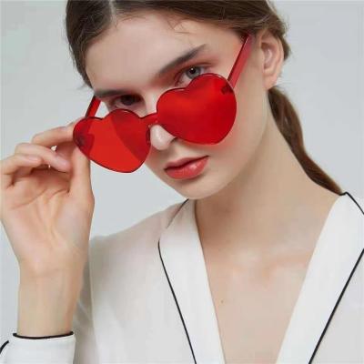 China 2022 Luxury Stylish Rimless Party Sunglasses Fashion Women Sun Glasses Famous Brands Transparent One Piece Fancy Solid Color for sale