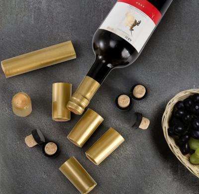 China OEM ODM Custom Wine Bottle Cork With Black Plastic Top Gold PVC Shrink Capsule for sale