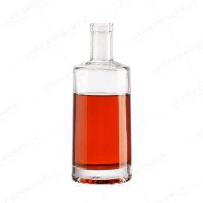 China ODM 500 ml 700 ml 750 ml Botella redonda de vidrio de licor con corcho de sellado en T en venta