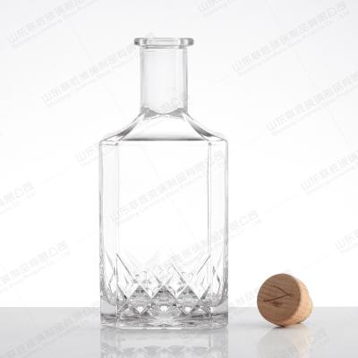 China Glass Wine Bottle 500ml 750ml Round Glass Vodka Bottle Rum Glass Liquor Bottle With Cork for sale