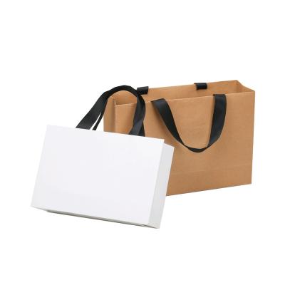 China Recyclable Factory Direct Cheap Logo Stock Gift White Paper Carry Bags With Handles For Customized Shopping for sale