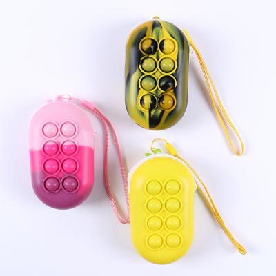 China Factory Price Portable Wholesale Silicone Mini Purse Stress Relief Playing Colorful Toys Invent Change Purse for Kids and Girls for sale