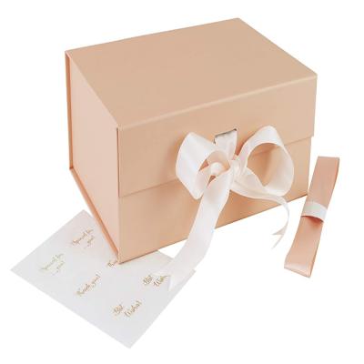 China Premium Materials PSB Materials Reused Pink Foldable Magnetic Bridesmaid Closure Gift Packaging Box With Ribbon Handle Design for sale