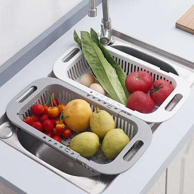 China Viable telescopic kitchen sink drain rack of vegetables and fruit drain storage basket water drying tools for sale