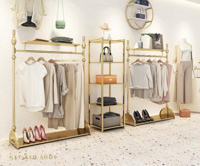 China Floor-type women's clothing store shelf display rack gold combination European clothes 88575 clothing store display rack for sale