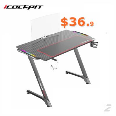 China Hot Selling Icockpit Adjustable Metal Legs Ergonomic Computer Desk Gaming Table (Other) Ergonomic LED Workstation Lights PC Computer RGB Gaming Desk for sale