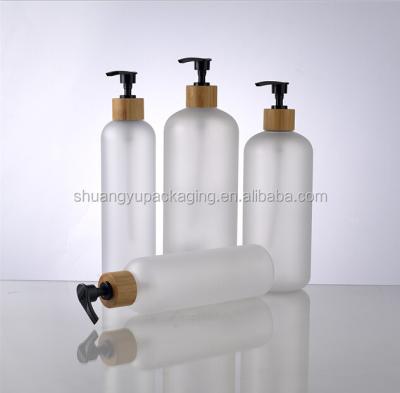 China 250ml frosted pet bottle boston round plastic bottle with bamboo lotion pump for sale