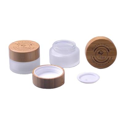 China 15ml frosted glass jar with child proof bamboo lid with CFR1700 certification eco friendly packaging packaging for sale