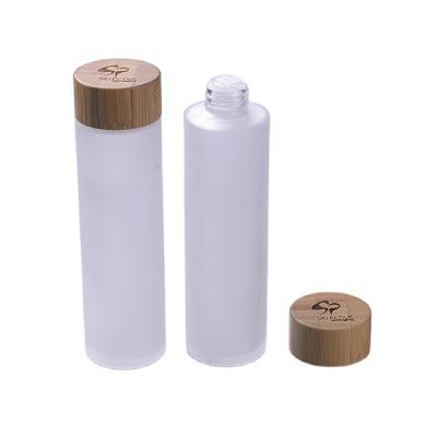 China 150ml Frosted Glass Bottle Cap Lotion Bottle with Bamboo Spray and Bamboo PUMP Sprayer Screen Printing Cosmetic Frosted Clear for sale