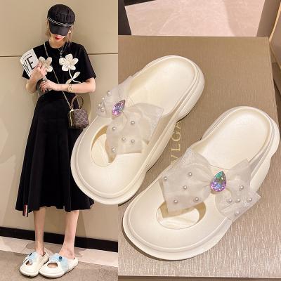 China Cushioning 2022 Women's Crystal Bow Thick Soles Light Up Soft Unique Slippers Girls Home Beach Slippers for sale