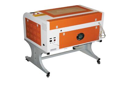 China Mini Computer Stamp CO2 Laser Cutting Machine Working Area 600*400mm for sale