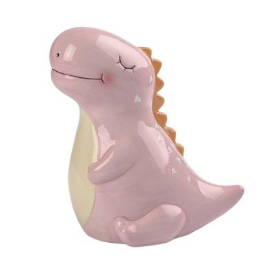 China Lovely And Useful Custom Funny Coin Bank Of Children's Toy Ceramic Dinosaur Shape for sale