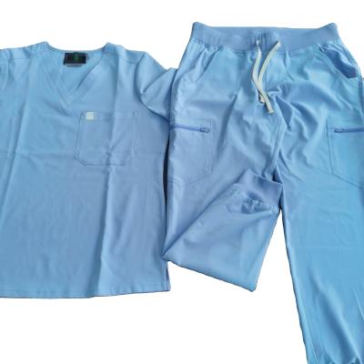 China Blue color comfortable and soft ceil hospital nursing uniform with cargo pocket and jogger pants scrubs suit with woven label for sale