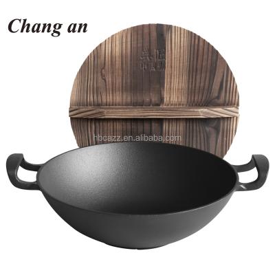 China Sustainable Preseasoned Cast Iron Kitchen Wok With Two Snubby Loop Handles for sale