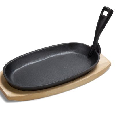 China General use for gas and induction cooker cast iron steak tray with wooden tray cast iron fajita pan for sale