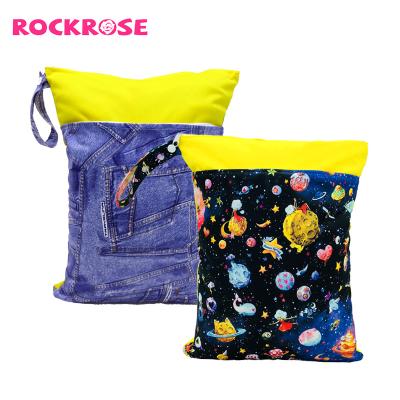 China Waterproof Water Resistant Rockrose 30*40cm PUL Printed Two Pockets Wet Diaper Bags Laundry Bag For Babies Cloth Diaper for sale