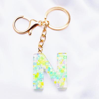 China Handmade Fashion 26 Letters Plastic Alphabet Resin Key Chain Pendant, Initial Car Bag Sequin Keychain Key Chain Key Holder for Women for sale