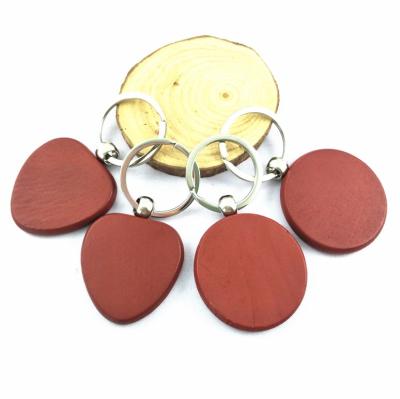 China Wood imitated wooden key chain circle red heart shaped mahogany round keychains, plain wood keyring custom logo real esate favor for sale