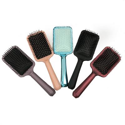 China New Design Private Label Paddle Hair Brush With Soft Cushion Detangling Hair Brush For Women for sale