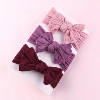 China Decoration Children's Hair Accessories Bow To Stretch Soft Jacquard Nylon Headband Accessories for sale