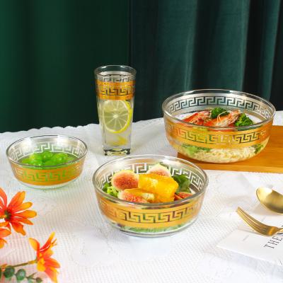 China Hot sale stocked clear glass bowl with gold design embossed salad bowl for sale