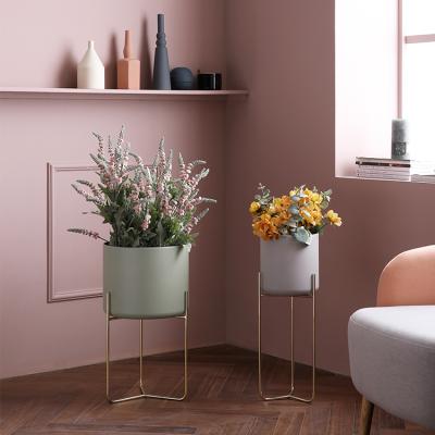 China Modern Nordic Living Room Flower Racks Floor Wrought Iron Radish Flower Pots Metal Indoor Green Decorative Flower Racks for sale