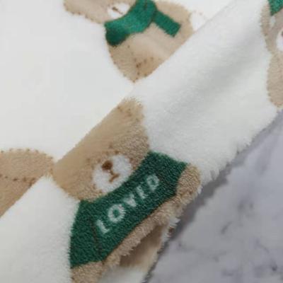 China 100% Sueded Good Quality Control Brushed Dimensional Knitted Polyester Flannel Fabric With Bear Pattern for sale