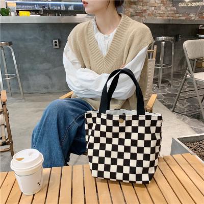 China 100% Eco-friendly Factory Grid Shopping Canvas White Black Lifestyles Tote Women's Smile Pattern Shoulder Bags for sale