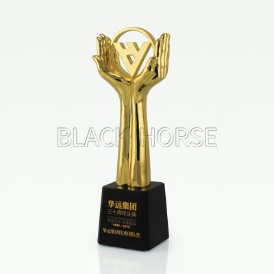 China China Customized Hands Holding Shape Trophy Design Metal Opens Awards for sale