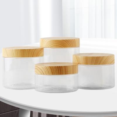 China 100ml/200ml/300ml/500ml Cosmetic Plastic Jar With Wooden Lids Screw On Clear Container Face Cream Powder Jar Empty Cosmetic Makeup Box for sale