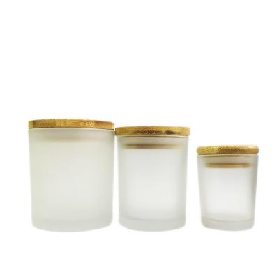 China Europen Luxury Candle Jars With Wooden Lid Bulk For Home Empty Frosted Glass Candle Ships Container Holders for sale