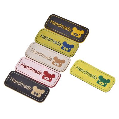 China Handmade CLOTHES Bear Printed PU Leather Garment Labels Tags For Clothes Diy Crafts Sewing Supplies for sale