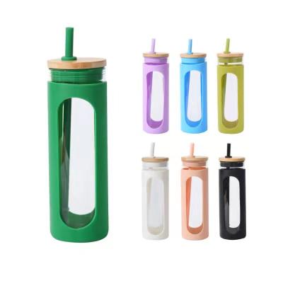 China Stocked 24 oz glass water bottle with bamboo straw and lid for sale