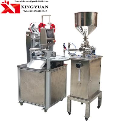 China Plastic Beverage Cup / Tube Filling And Sealing Machine Rotary Type Automatic Operation for sale