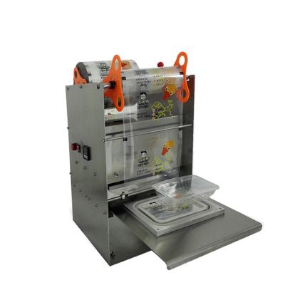 China Food Manual Type Electric Driven Food Container Sealing Machine Feeding With Plastic Film for sale