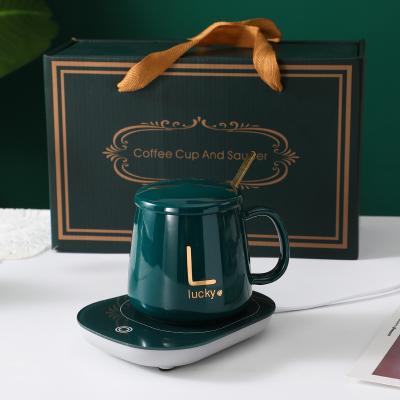 China Viable Wholesale Personalized Gift Promotional Ceramic Heated Mug Coffee Warmer for sale